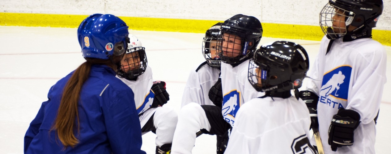 Kids Huddled Playing Hockey