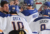 Carter Chorney (left) celebrates his gold medal-winning overtime goal with his Team Alberta teammates. (Photo courtesy The WHL/LA Media)