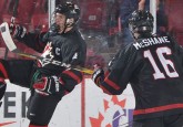 Team Alberta alumnus and World U17 Hockey Challenge All-Star Ty Smith (left) celebrates a goal with his Team Canada Black teammate. (Photo courtesy of Hockey Canada)
