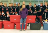 The Lloydminster PWM Steelers present 513 pairs of pajamas to Olivia Brockhoff for Project PJ