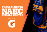 Image: Team Alberta Female Hockey Player holding a hockey stick